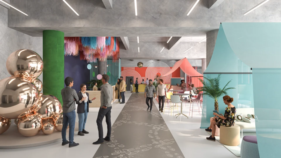 Einladender Empfangsbereich mit kreativer Dekoration, bunten Girlanden und modernen Lounge-Bereichen für Networking und Austausch